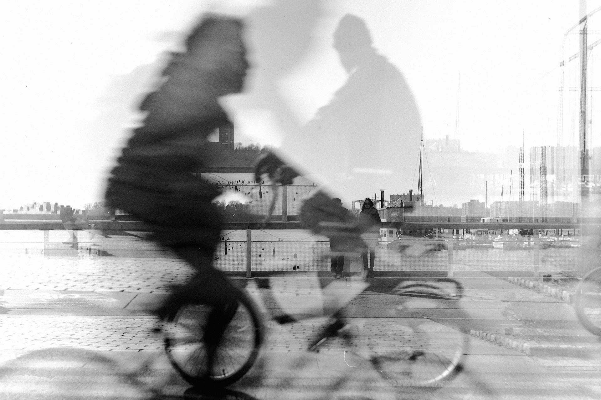 Double exposed photo of bicyclists